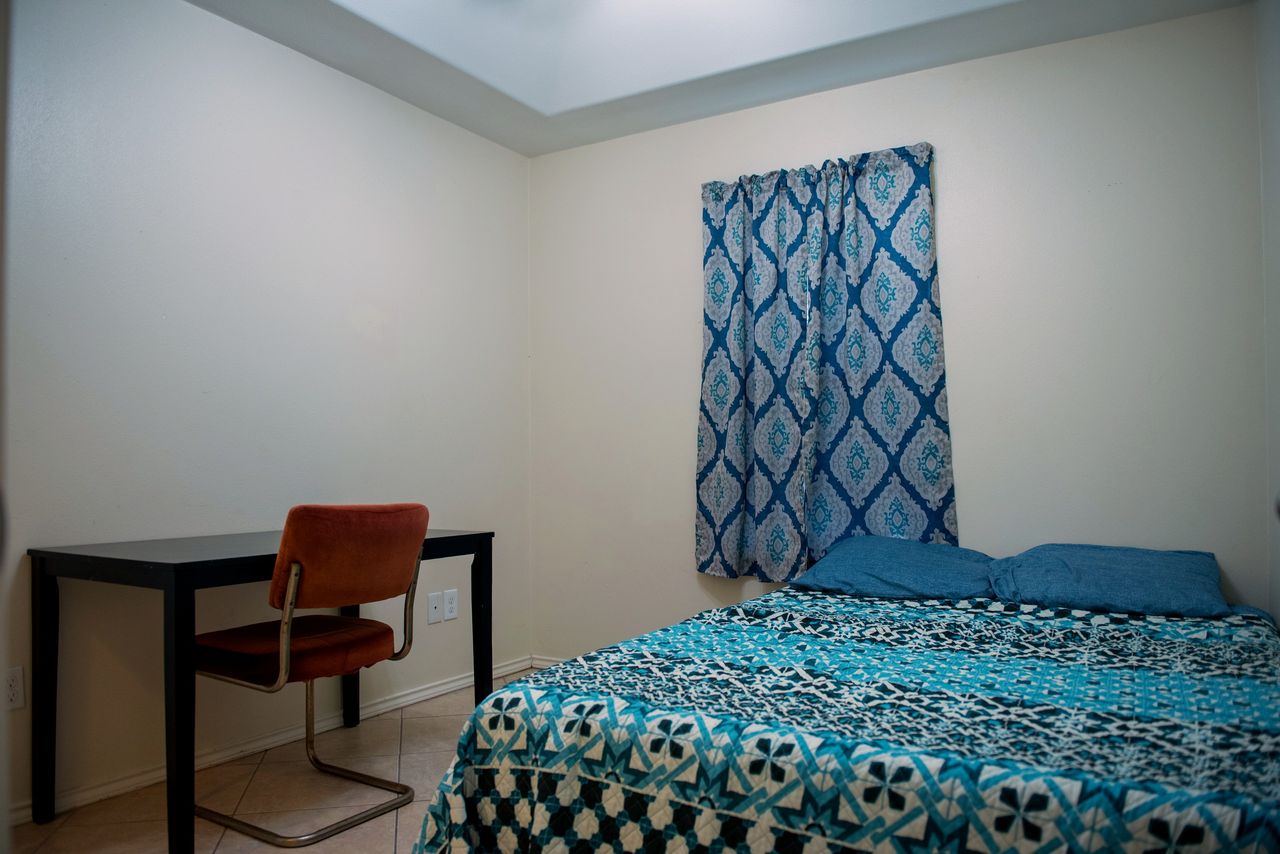 Third bedroom with a bed, desk and chair